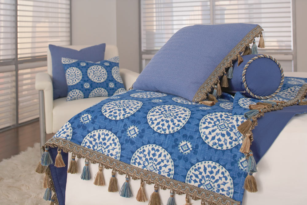 Blue Interior Masterpieces® Custom Pillows and Custom Bedding in a blue blanket with white circles that has Embellishment tassels